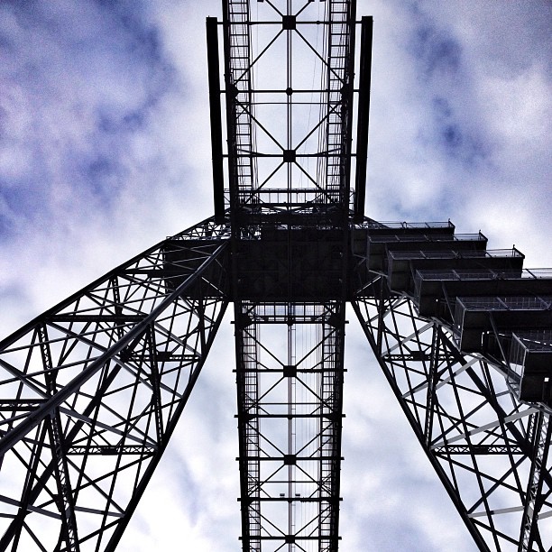 Looking up at the metal structure of the transporter bridge