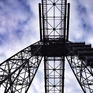 Looking up at the metal structure of the transporter bridge