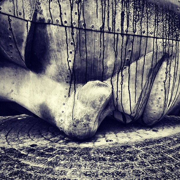 A large sculture of a face lying on the floor