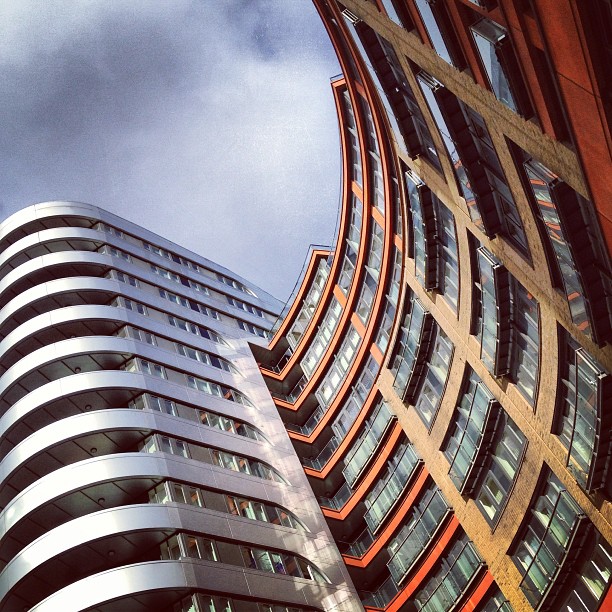 An angled view of a modern office block showing off its curves