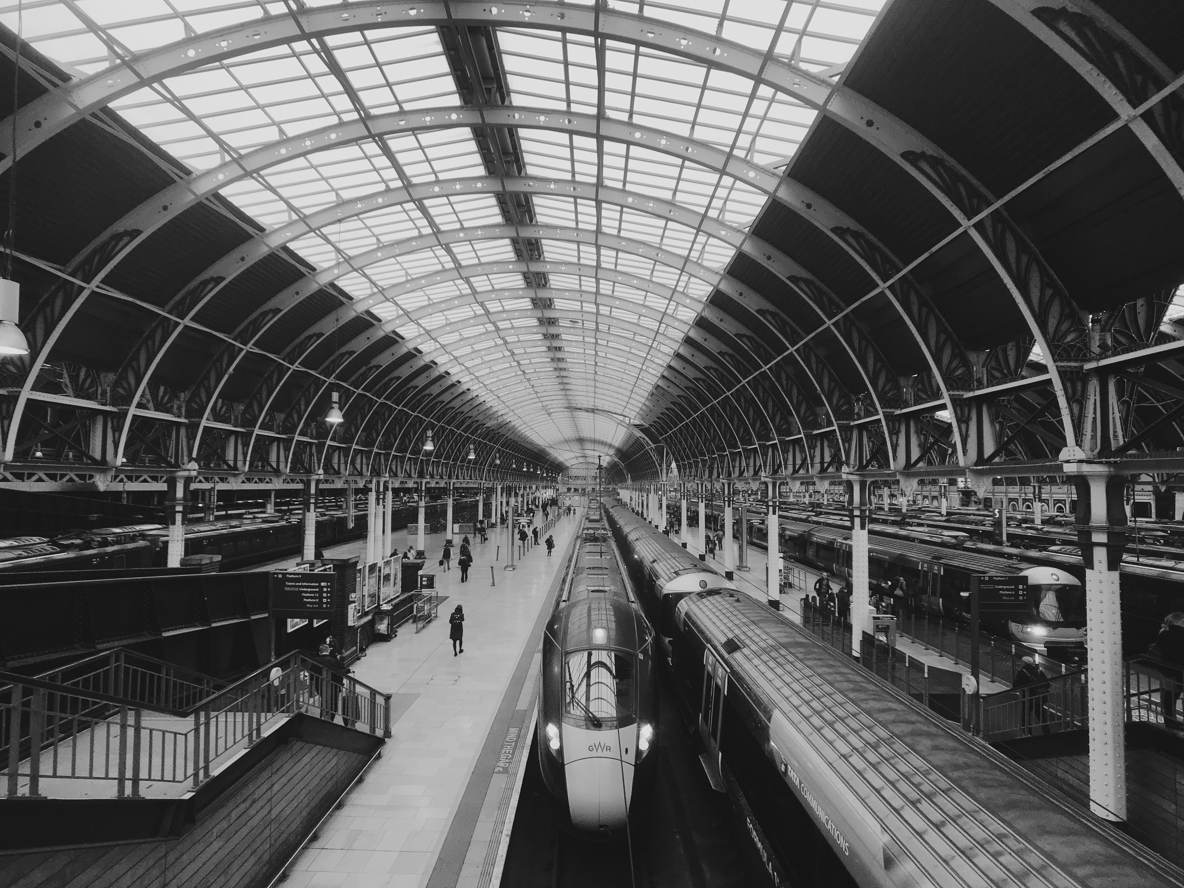 A train waiting under the curved roof in Paddington railway station