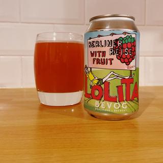 A can of raspberry ale alongside a glass containing a red beer